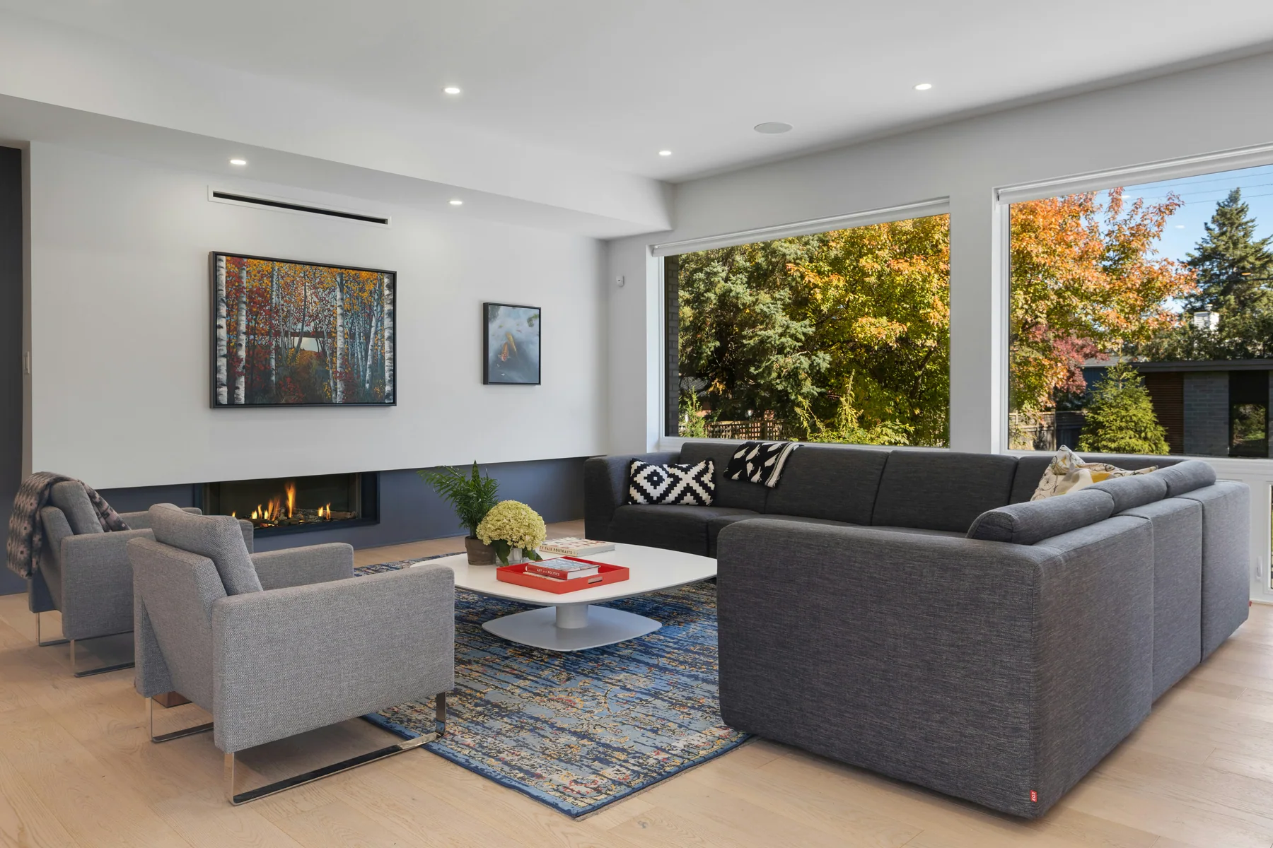 A bright contemporary living room with generous glazing and modern finishes