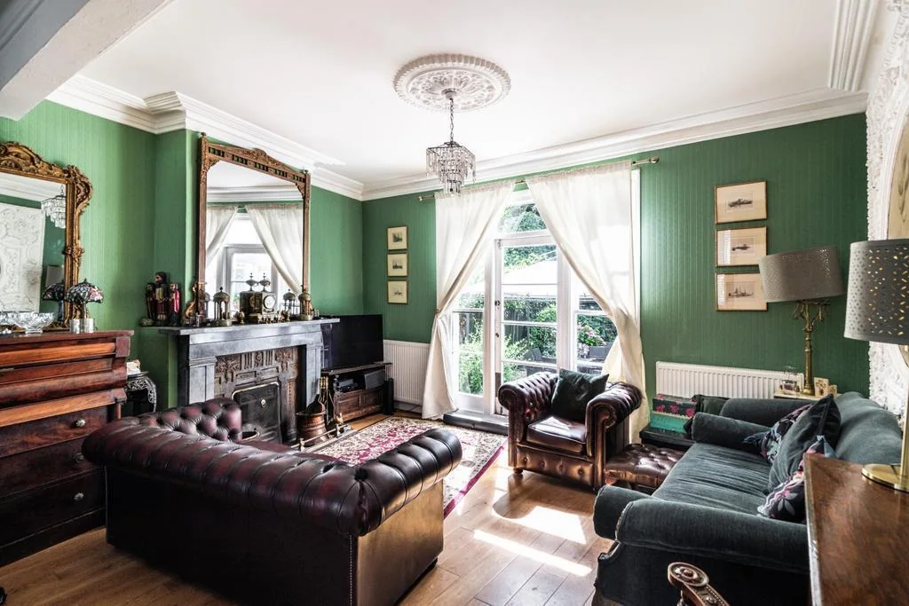 A dated period living room with clear refurbishment potential
